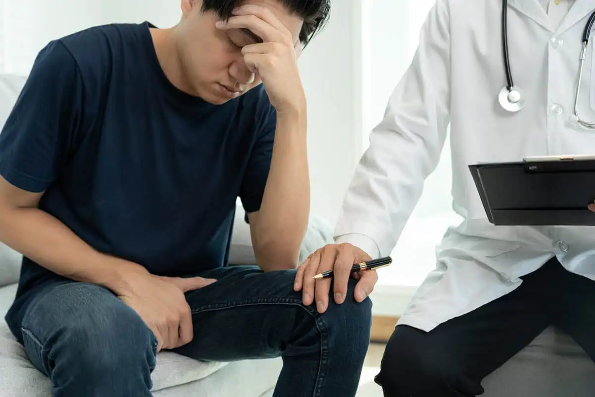 man discussing premature ejaculation treatment with doctor during private consultation in St. Louis, MO at Reclaim Med Spa and Wellness