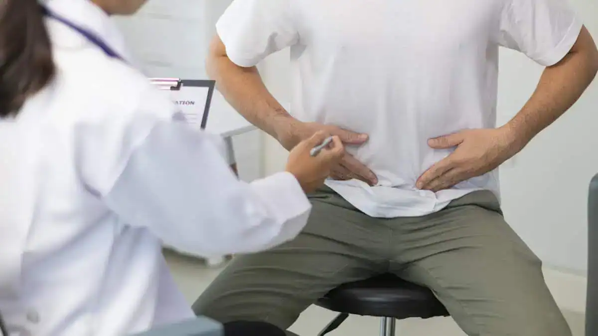 Male patient discussing P-Shot treatment results and recovery timeline with a healthcare provider in St. Louis